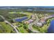 Aerial shot of a charming community with waterfront views, manicured lawns, and lush landscaping at 523 Wildlife Gln, Bradenton, FL 34209