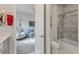 View into bathroom and sitting room; marble tiling, tub/shower combo, toilet, and vanity are featured at 523 Wildlife Gln, Bradenton, FL 34209