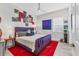 Vibrant bedroom with unique wall art, bright pops of color and wood-look flooring at 523 Wildlife Gln, Bradenton, FL 34209