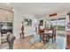 Elegant dining area with stylish lighting, seamless access to the lanai, and views of the pool at 523 Wildlife Gln, Bradenton, FL 34209