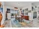 Elegant dining area with stylish lighting, seamless access to the lanai, and views of the surrounding landscape at 523 Wildlife Gln, Bradenton, FL 34209