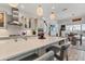 Modern kitchen featuring an island with bar seating, stainless steel appliances, and sleek countertops with ample cabinet space at 523 Wildlife Gln, Bradenton, FL 34209
