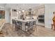 Modern kitchen featuring an island with bar seating, stainless steel appliances, and sleek countertops with ample cabinet space at 523 Wildlife Gln, Bradenton, FL 34209