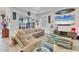 Cozy living room features modern furnishings, stylish decor, and ample natural light from the sliding glass door at 523 Wildlife Gln, Bradenton, FL 34209