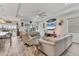 Spacious living area with high ceilings, an open floor plan, and comfortable seating adjacent to the dining area at 523 Wildlife Gln, Bradenton, FL 34209