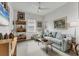 Bright living room with comfortable seating, ceiling fan, window, artwork, and a calming atmosphere at 523 Wildlife Gln, Bradenton, FL 34209