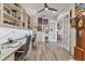 Bright office space with custom built-ins, workspace, and French doors leading to living area at 523 Wildlife Gln, Bradenton, FL 34209