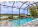 Enclosed pool with a waterfront view, providing a private oasis for relaxation and recreation at 523 Wildlife Gln, Bradenton, FL 34209