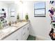 Bright bathroom featuring double sinks with granite countertops, providing ample space and modern appeal at 5333 Coral Reef Way, Bradenton, FL 34211