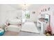 Bright bedroom featuring a canopy bed, vanity area, and charming decor, creating a delightful and inviting space at 5333 Coral Reef Way, Bradenton, FL 34211