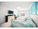 Bright bedroom with blue accent wall, light-colored furniture, and carpeted floor at 5333 Coral Reef Way, Bradenton, FL 34211