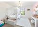 Charming bedroom with a canopy bed, chandelier, and vanity at 5333 Coral Reef Way, Bradenton, FL 34211
