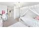 Charming bedroom with a white canopy bed, chandelier, and a cozy desk area, perfect for a retreat at 5333 Coral Reef Way, Bradenton, FL 34211