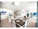 Open-concept kitchen and dining area showcasing a modern island with seating and a cozy dining table at 5333 Coral Reef Way, Bradenton, FL 34211