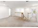 Spacious upstairs landing featuring carpet, white walls, and plenty of natural light at 5333 Coral Reef Way, Bradenton, FL 34211