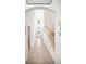 Bright foyer with tile flooring, arched entryway, and staircase at 5333 Coral Reef Way, Bradenton, FL 34211