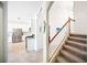 Hallway featuring stairs, with an open view of the kitchen at 5333 Coral Reef Way, Bradenton, FL 34211