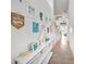 Bright hallway with coastal decor and unique architectural details throughout the home at 5333 Coral Reef Way, Bradenton, FL 34211