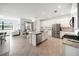 Modern kitchen showcasing island, stainless appliances, and dining area at 5333 Coral Reef Way, Bradenton, FL 34211