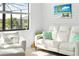 Relaxing living room featuring ample natural light, comfortable seating, and stylish decor at 5333 Coral Reef Way, Bradenton, FL 34211