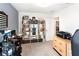 Home office with a large bookshelf, a desk, and a view of the room at 5333 Coral Reef Way, Bradenton, FL 34211