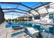 Relaxing screened pool area featuring a spa, lounge chairs, and ample space for Gathering fun at 5333 Coral Reef Way, Bradenton, FL 34211