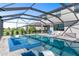 Inviting screened pool and spa area, perfect for entertaining with plenty of seating and open space at 5333 Coral Reef Way, Bradenton, FL 34211