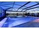 Screened-in pool and spa with a tranquil view of the lake and surrounding neighborhood at 5333 Coral Reef Way, Bradenton, FL 34211
