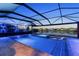 Beautiful screened-in pool and spa overlooking a serene lake, perfect for relaxation and outdoor enjoyment at 5333 Coral Reef Way, Bradenton, FL 34211