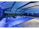 Screened-in pool and spa with a tranquil view of the lake and surrounding neighborhood at 5333 Coral Reef Way, Bradenton, FL 34211