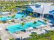 Aerial view of swimming pools, lounging areas, and clubhouse in a resort-style community at 5333 Coral Reef Way, Bradenton, FL 34211