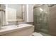 Sleek bathroom featuring modern vanity, large mirror, and a frameless glass shower at 553 Meadow Sweet Cir, Osprey, FL 34229