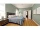 Stylish bedroom featuring wood floors, a modern bed, and neutral-toned walls for a serene aesthetic at 553 Meadow Sweet Cir, Osprey, FL 34229