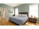 Bright bedroom with a large window, comfortable bed, and modern décor for a relaxing space at 553 Meadow Sweet Cir, Osprey, FL 34229