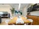 Elegant dining room features modern lighting, a dining table, and stylish decor at 553 Meadow Sweet Cir, Osprey, FL 34229
