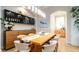 Dining room with natural light, a modern light fixture, and a buffet cabinet at 553 Meadow Sweet Cir, Osprey, FL 34229