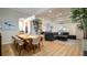 Open-concept living space featuring modern decor, hardwood floors, and abundant natural light at 553 Meadow Sweet Cir, Osprey, FL 34229