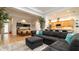 Open floor plan with a living room featuring a sectional, alongside a dining area and kitchen at 553 Meadow Sweet Cir, Osprey, FL 34229