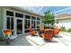 Outdoor screened-in patio featuring seating, a garden view, and access to the main house at 553 Meadow Sweet Cir, Osprey, FL 34229