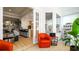 Bright sitting room featuring comfortable seating, an open layout, and a view of the adjacent kitchen and living areas at 553 Meadow Sweet Cir, Osprey, FL 34229