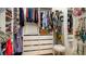 Organized walk-in closet with ample shelving and storage for clothes, shoes, and accessories at 553 Meadow Sweet Cir, Osprey, FL 34229