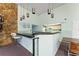 Stylish bar area featuring sleek countertops, pendant lighting, and comfortable seating at 5709 13Th W Ave, Bradenton, FL 34209