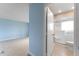 Bright bathroom featuring a walk-in shower with sliding glass doors and tiled flooring at 5709 13Th W Ave, Bradenton, FL 34209