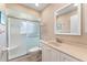 Bathroom featuring a white vanity, toilet, and walk-in shower with sliding glass doors at 5709 13Th W Ave, Bradenton, FL 34209