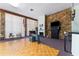 Welcoming common room with a stone accent wall, piano, and seating area at 5709 13Th W Ave, Bradenton, FL 34209