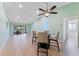 Bright living room features tile floors, vaulted ceilings with fan, and sliding doors to an outdoor patio at 5709 13Th W Ave, Bradenton, FL 34209