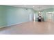 Bright open living space with neutral tile flooring, ceiling fan, and direct access to the kitchen at 5709 13Th W Ave, Bradenton, FL 34209