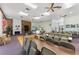 Spacious meeting room featuring a stone fireplace, tables, and comfortable seating at 5709 13Th W Ave, Bradenton, FL 34209