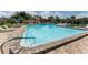 Sparkling community pool with comfortable lounge chairs and umbrellas for relaxation at 5709 13Th W Ave, Bradenton, FL 34209