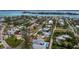 Aerial view showcasing a residential area with lush greenery and a swimming pool at 580 Russell St, Longboat Key, FL 34228